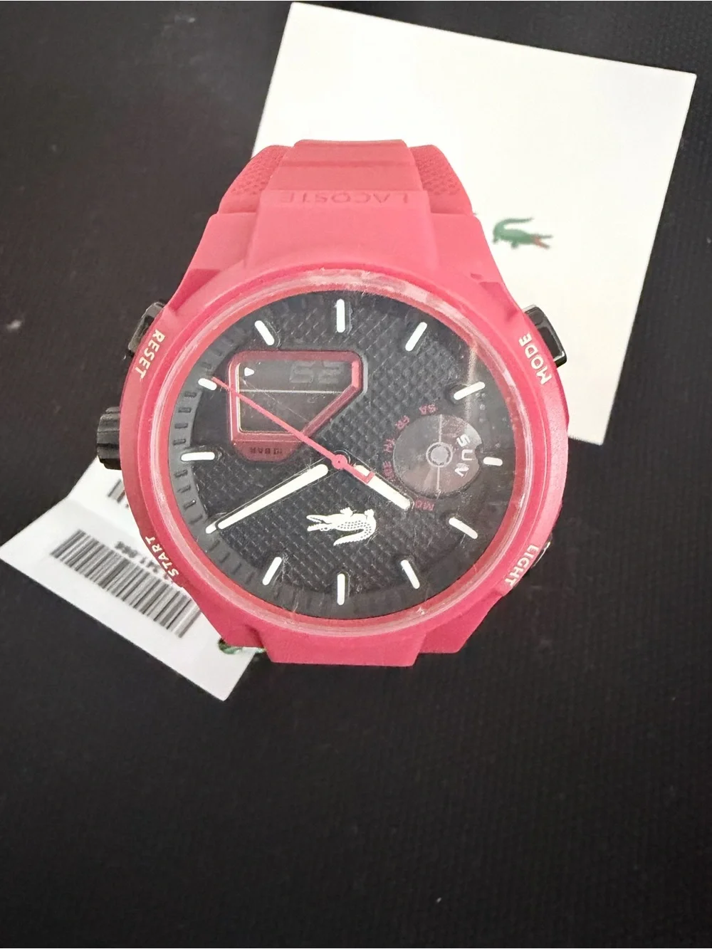 Brand new Lacoste Unisex Analog & Digital Watch in red with black dial.
